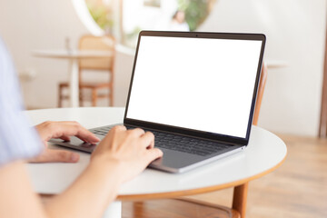 computer blank screen mockup.hand woman work using laptop with white background for advertising,contact business search information on desk at coffee shop.marketing and creative design