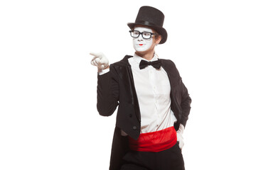 Portrait of male mime artist performing, isolated on white background. Mime points and chooses with...
