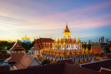Golden metal castle illuminated, Wat Ratchanatdaram Woravihara, Loha Prasat temple in the morning at Bangkok city, Thailand