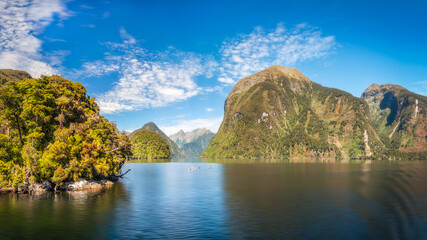 Beautiful panoramic views with incredible alpine scenery, an awesome day to spend on the water either on a cruise or kayaking at Doubtful Sound in New Zealand, South Island.