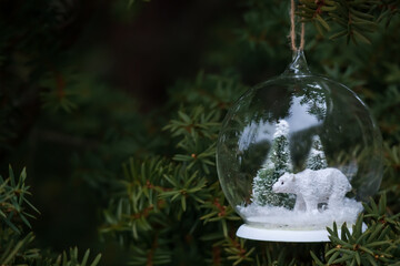 Polar Bear Snow Globe Hanging in a Tree