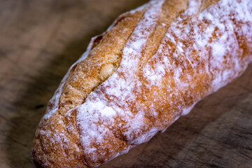 baguette is on a table at kitchen.