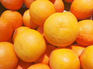 Healthy fruits, orange fruits background many orange fruits - orange fruit background in a supermarket super store