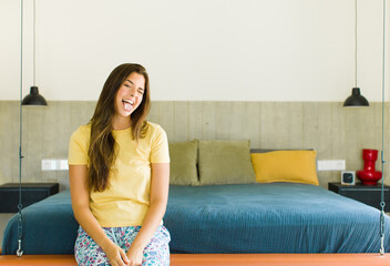pretty woman with cheerful, carefree, rebellious attitude, joking and sticking tongue out, having...