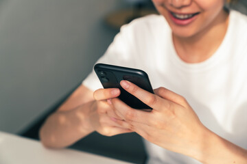Woman using smartphone, During leisure time. The concept of using the phone is essential in everyday life.
