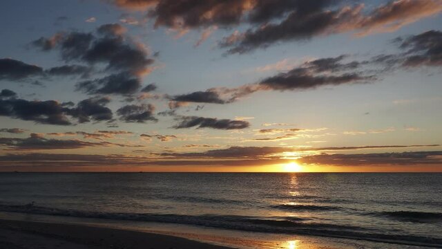 Waves gently lapping onto the sand at St. Pete Beach, Florida on the Gulf of Mexico.
