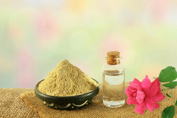 fuller earth or multani mitti for herbal ayurvedic face pack with rose and rosewater bottle