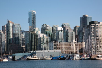 Fototapeta na wymiar View of Vancouver downtown skyline and coal harbour seen from Vancouver Stanley Park, British Columbia, Canada.