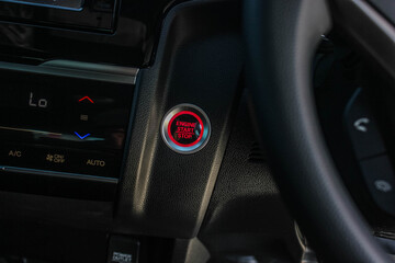 Close up engine car start button. Start stop engine modern new car button,Makes it easy to turn...