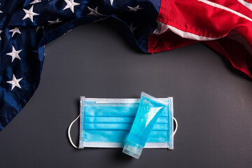 Medical protective disposable face mask for cover mouth and America flag, studio shot on gray background, Safety healthcare medical prevent coronavirus or Covid-19