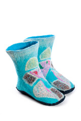 Turquoise felt socks with a pattern on a white background