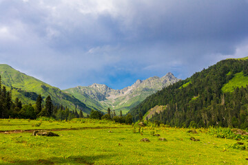 Fototapeta na wymiar Scenery mountain landscape at Caucasus mountains with clouds.