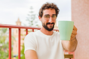young bearded man having a coffee