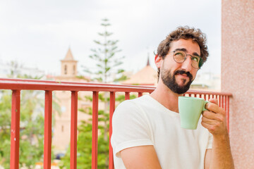 young bearded man having a coffee