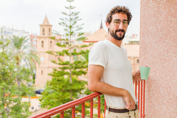 young bearded man having a coffee
