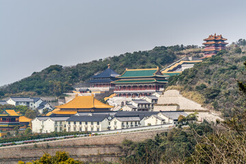 Chinese traditional colorful temples in the Putuoshan mountains, Zhoushan Islands,  a renowned site in Chinese bodhimanda of the bodhisattva Avalokitesvara (Guanyin)