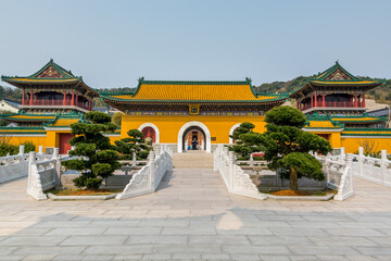 Fototapeta premium Chinese traditional royal style colorful temples in the Putuoshan mountains, Zhoushan Islands, a renowned site in Chinese bodhimanda of the Guanyin