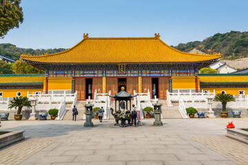 Obraz premium Chinese traditional royal style colorful temples in the Putuoshan mountains, Zhoushan Islands, a renowned site in Chinese bodhimanda of the Guanyin