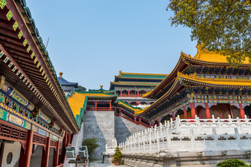 Fototapeta premium Architectural details of Chinese traditional royal style colorful Baoxiang lecture temples in the Putuoshan mountains, Zhoushan Islands, a renowned site in Chinese bodhimanda of the Guanyin
