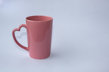 Fototapeta premium A pink mug on a white background.