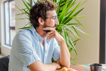 young man having breakfast at home