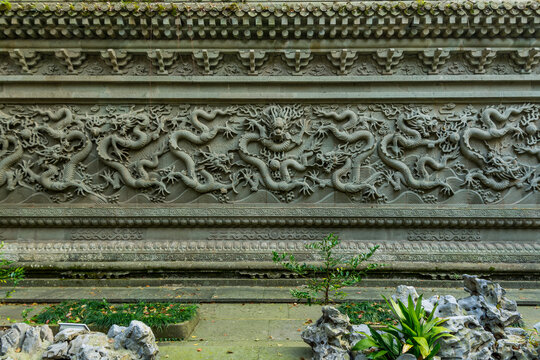 Dragon carving on the wall at the Buddhist Fayu Temple in the Putuoshan mountains, Zhoushan Islands,  a renowned site in Chinese bodhimanda of the bodhisattva Avalokitesvara (Guanyin)