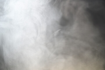 Grey smoke on a black background, fog on a dark background