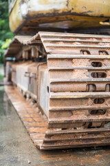 Selective focus of  Old Backhoe crawler wheels