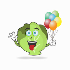 Cabbage mascot character holding a balloon. vector illustration