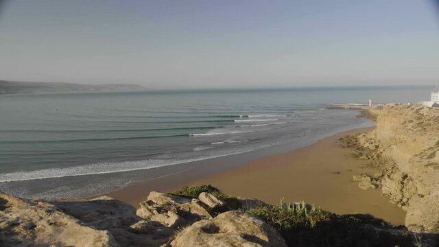 Panorama of Imsouane bay. Sunrise at the beach with surfers in morocco. beautiful lines with waves
