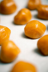 Chocolate nut biscuits being prepared for baking, food background.