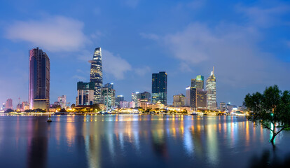 Plakat Overview of Ho Chi Minh city riverside at night. Ho Chi Minh city is the largest economic center in Vietnam.
