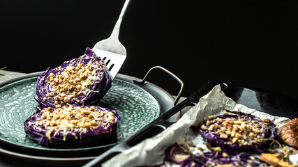 Close up roasted balsamic thyme red cabbage, quince and apples, Vegan baked red cabbage steaks,...