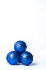 Blue Christmas baubles on a white background.