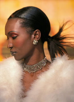 Young woman in jewelry and fur