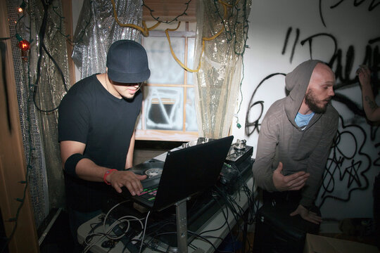 DJ with turntable at party