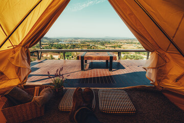 young Thai teen boy brunette tourist adult man asian mature sitting looking into the sky outdoors on a hike mountains viewpoint at chiang mai, mon jam, Thailand.