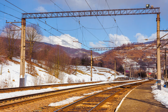 railway station in mountains. frosty winter landscape. transportation scenery
