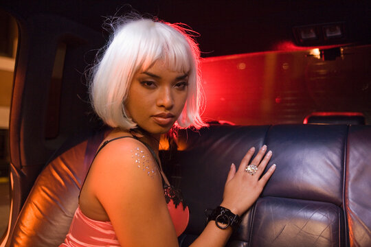 Portrait of prostitute in limousine