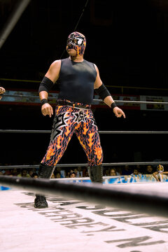Hispanic man wearing Mexican wrestling costume