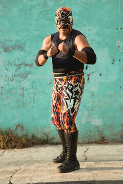 Hispanic man wearing Mexican wrestling costume