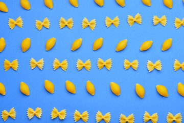 Tasty uncooked pasta on color background