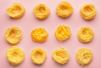Tasty uncooked pasta on color background