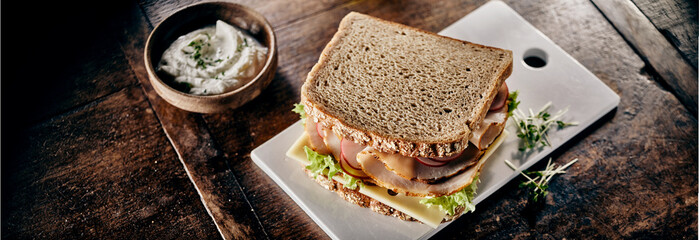Ham sandwich with watercress and salad greens