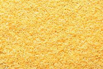 Tasty uncooked pasta as background