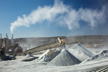 Rock stone crushing equipment in a limestone quarry.
