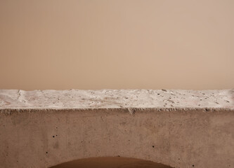 Minimal modern natural stone product display on pastel beige background. 