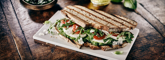 Delicious rye bread sandwich with pesto and rocket