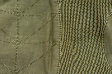 Green color fabric texture background, close up. Top view, copy space.