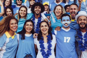 Group of Argentinian soccer fans in stadium - obrazy, fototapety, plakaty